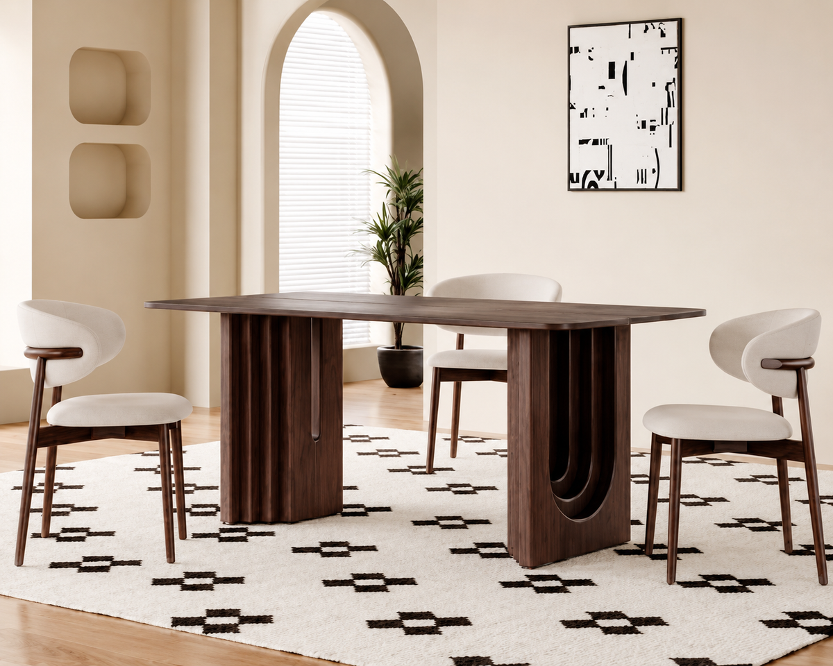 Arcwood sculptural dining table styled in a warm modern dining room