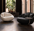 Concha shell-inspired lounge chairs styled in a refined modern interior