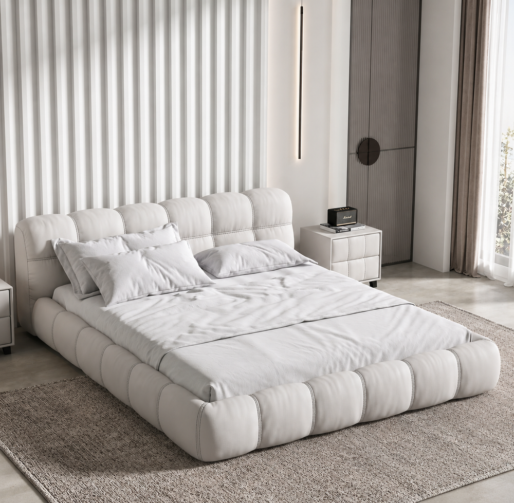 Cumulo cloud-tufted upholstered bed styled in a refined modern bedroom
