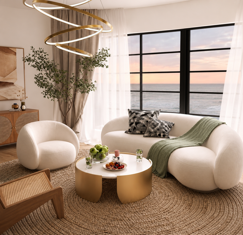 Flufra ivory curved sofa styled in a refined modern living room