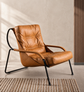Marrakesh cognac sling lounge chair styled in a warm modern interior