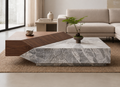 Plinthstone natural stone coffee table styled in a refined modern living room