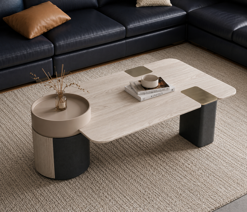 Slaterra sculptural coffee table set styled beside a modern black sectional sofa