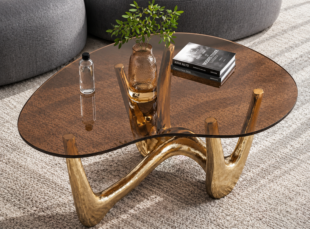 Topazo amber glass coffee table styled beside a modern curved sofa